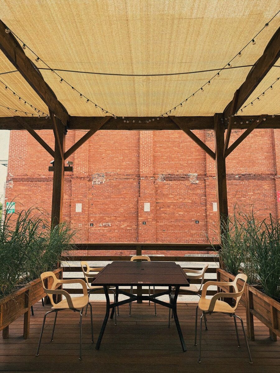 Outdoor seating area with tables and chairs.