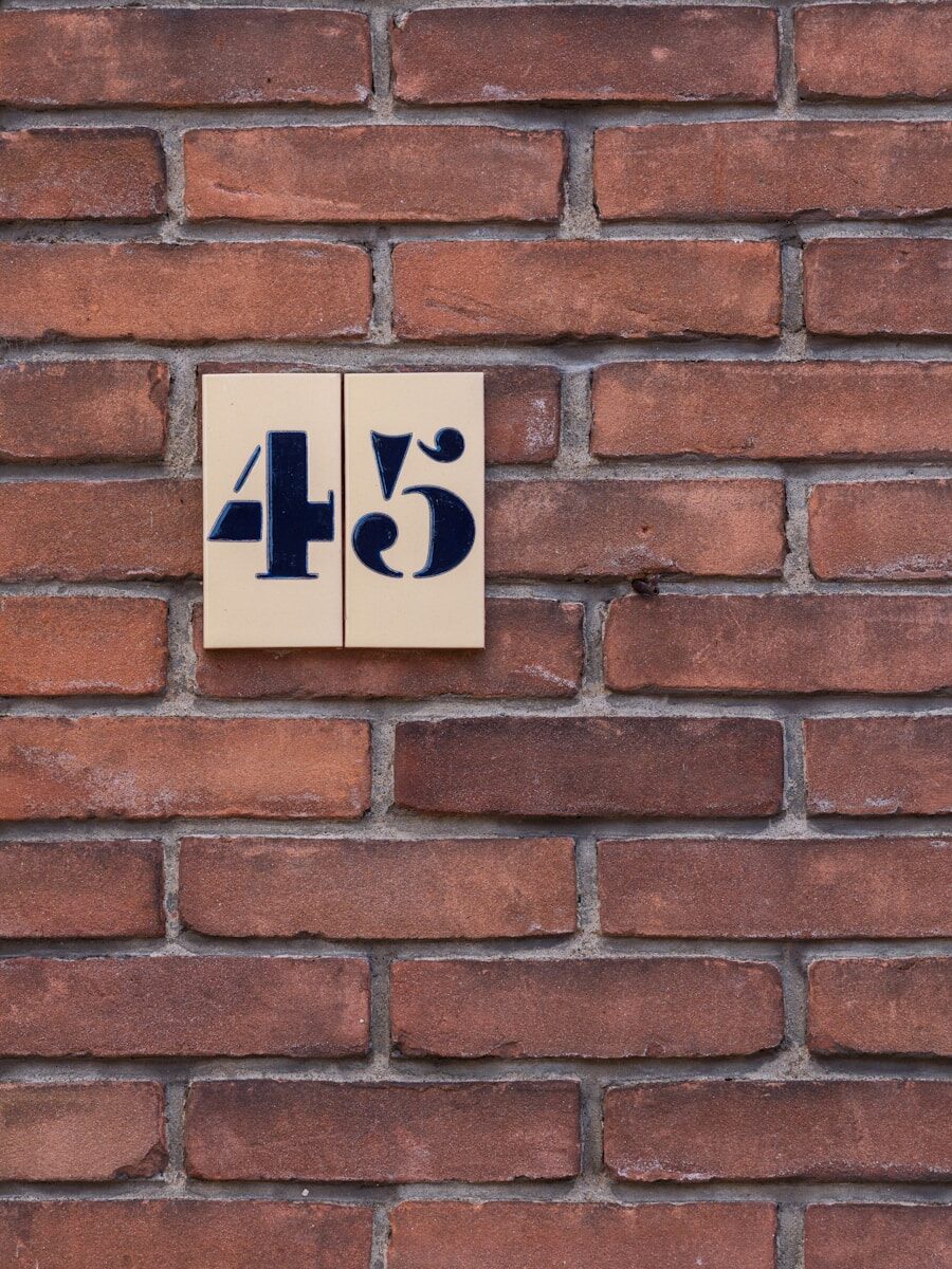 Brick wall with the number forty-five.
